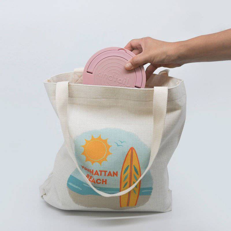 Portabowls – Portable & Travel Dog Bowl & Pet Bowl in pink in a canvas bag with white back drop